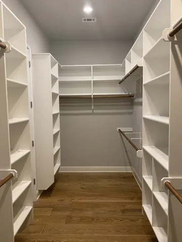 a view of an empty walk in closet
