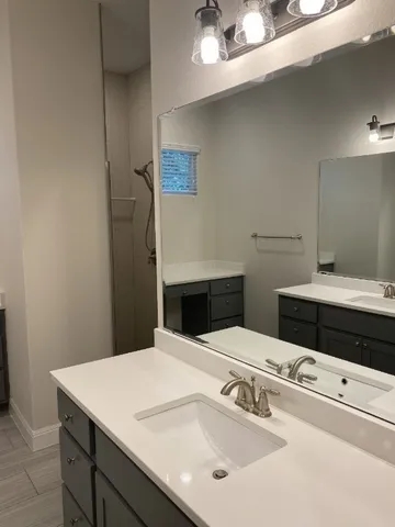 a bathroom with a sink and a mirror