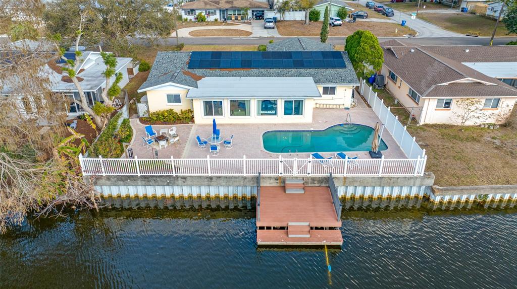 1822 Winchester Road North St. Petersburg, FL 33710 - Photo 1 of 1 a balcony with table and chairs