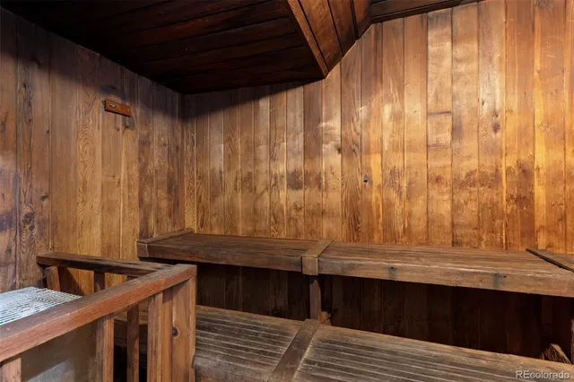 a dining room with furniture and a floor to ceiling window