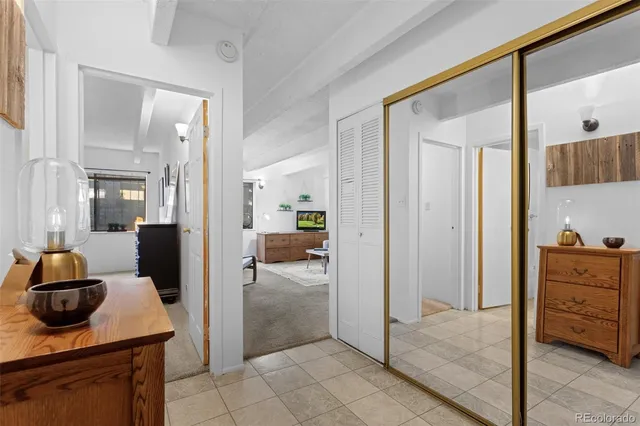 a view of a hallway and a livingroom and a living room