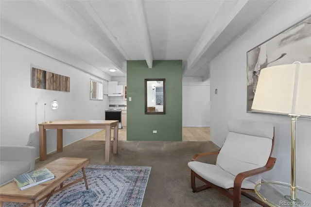 a living room with furniture and a table