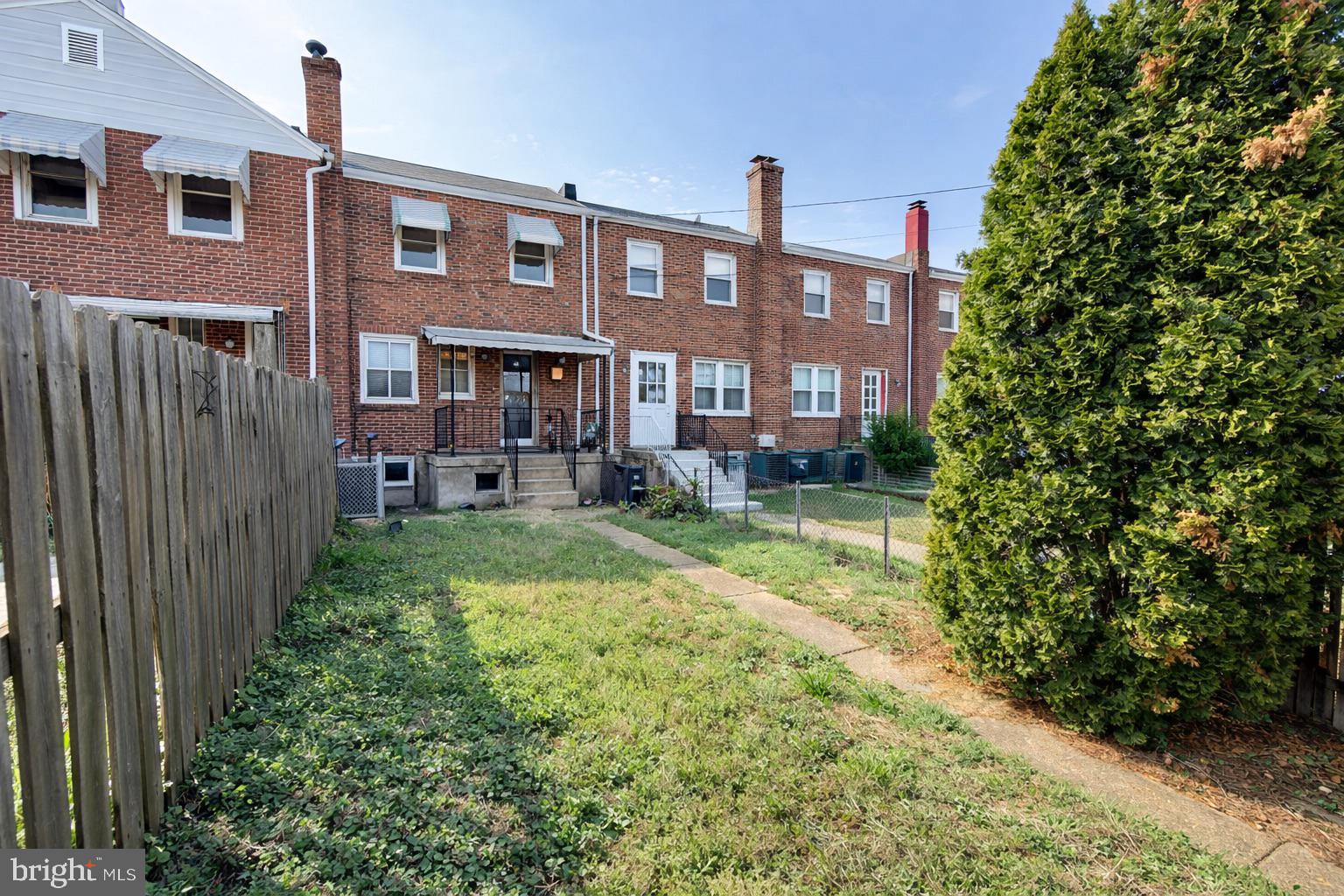 3325 McShane Way Baltimore, MD 21222 - Photo 13 of 23 a front view of a house with garden
