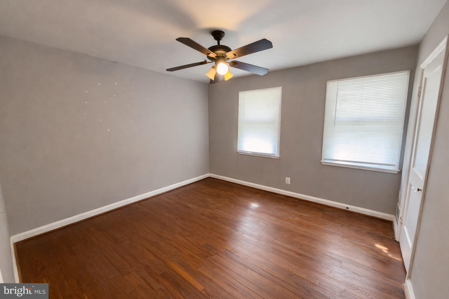 3325 McShane Way Baltimore, MD 21222 - Photo 14 of 23 an empty room with windows and fan