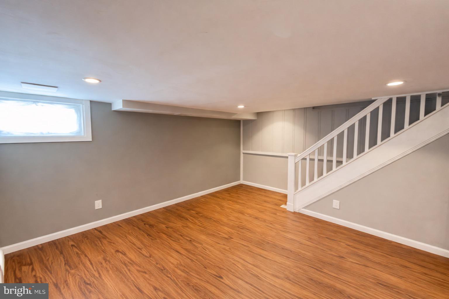 3325 McShane Way Baltimore, MD 21222 - Photo 20 of 23 a view of an empty room with wooden floor