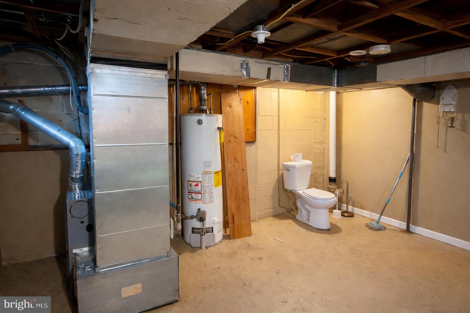 3325 McShane Way Baltimore, MD 21222 - Photo 23 of 23 a bathroom with a toilet and a shower