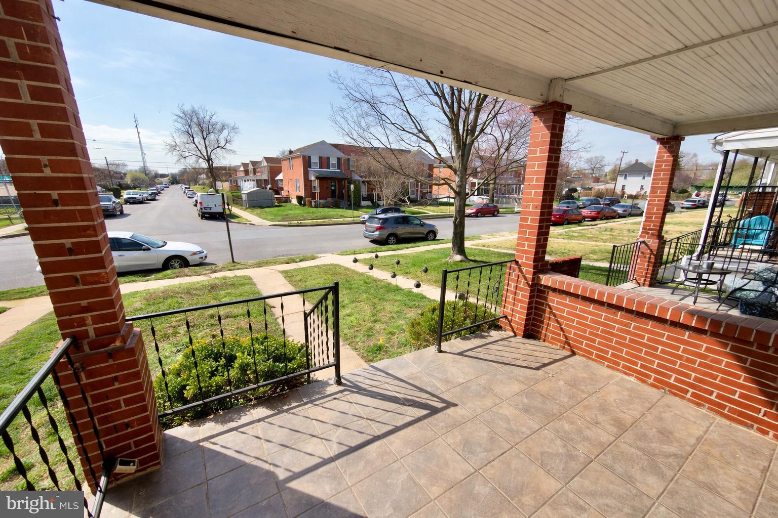 3325 McShane Way Baltimore, MD 21222 - Photo 3 of 23 a view of a patio with a table chairs and a patio