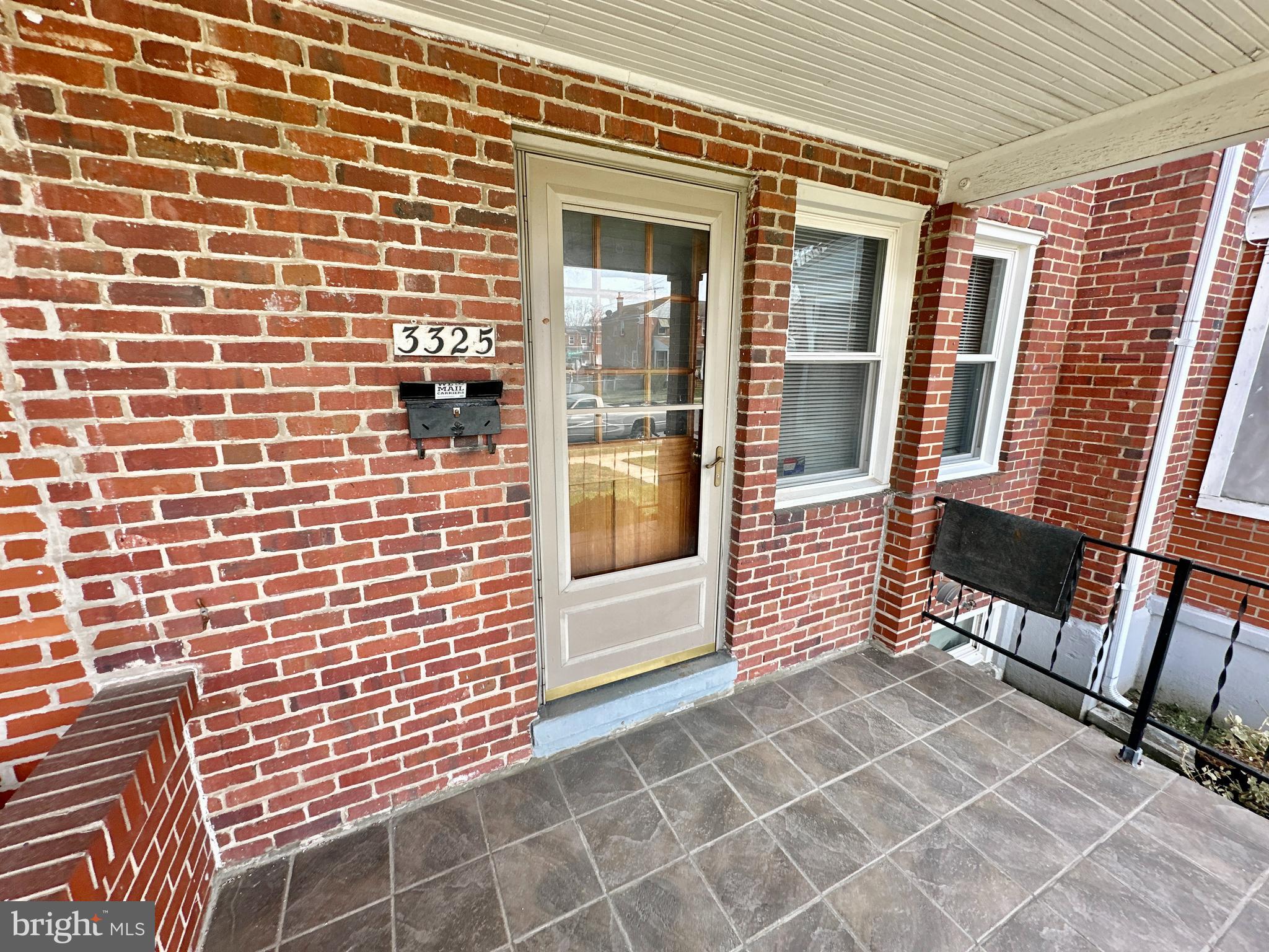 3325 McShane Way Baltimore, MD 21222 - Photo 4 of 23 a view of a brick wall with a large window