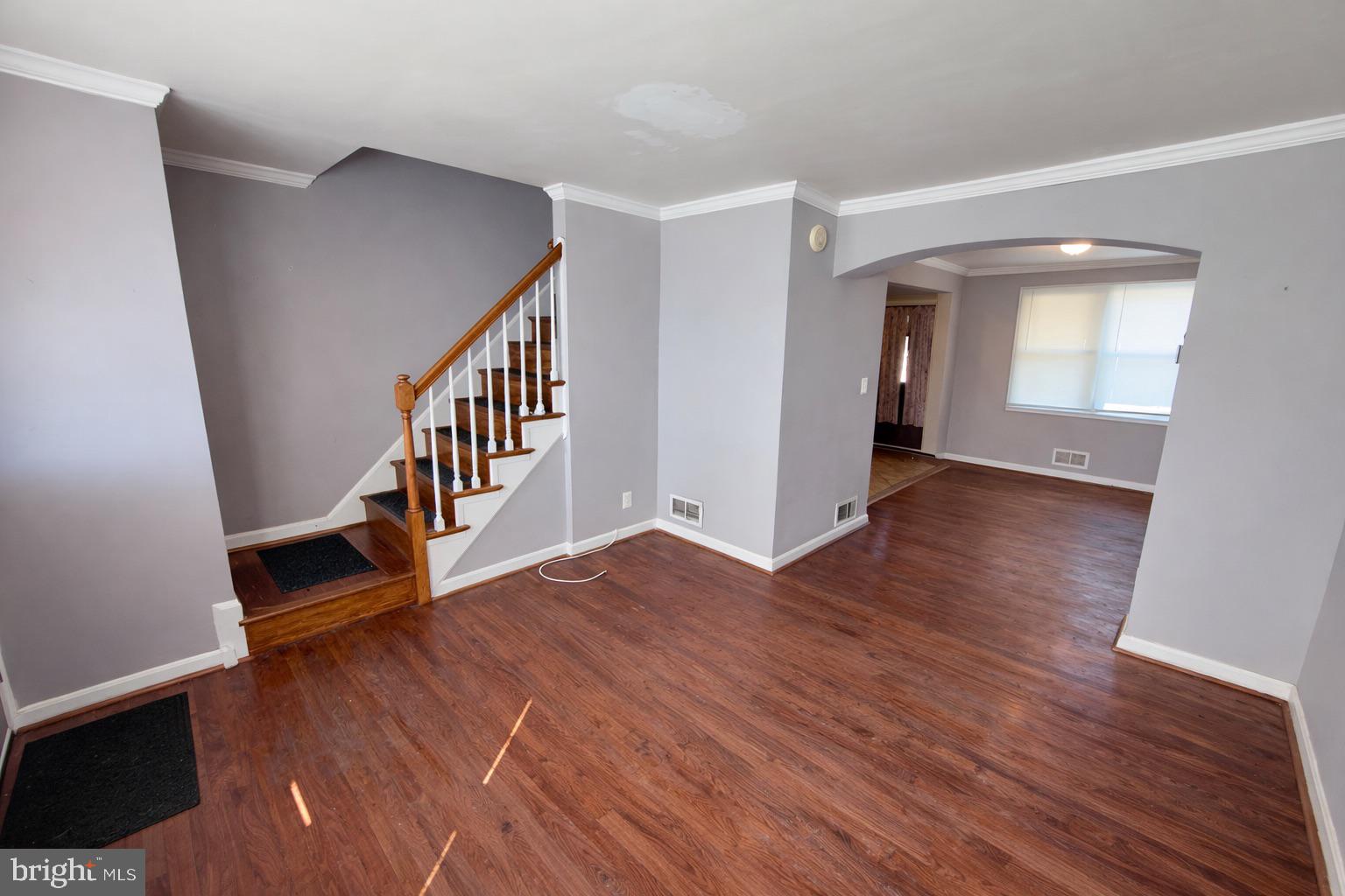 3325 McShane Way Baltimore, MD 21222 - Photo 6 of 23 a view of an entryway with wooden floor