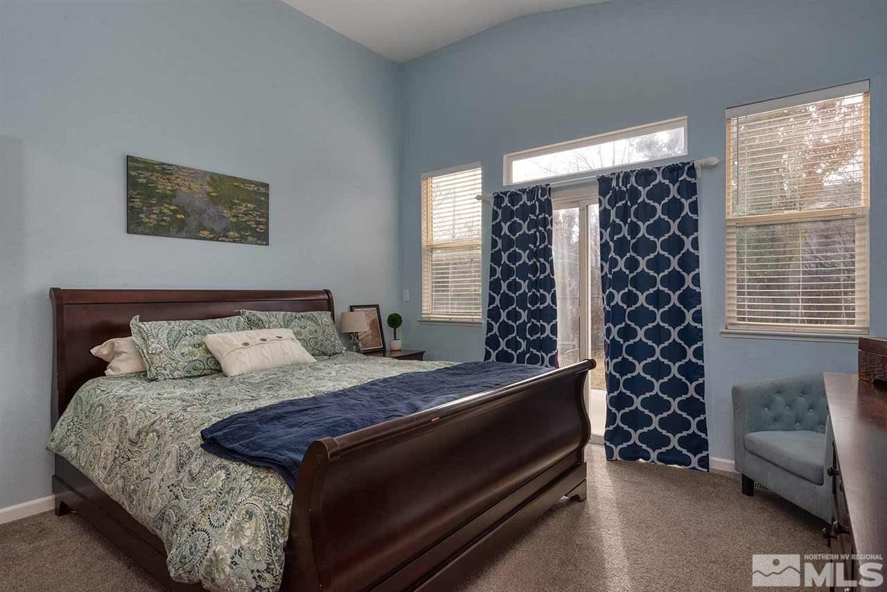 5540 Daybreak Drive Reno, NV 89523 - Photo 16 of 23 a bed sitting in a bedroom next to a window