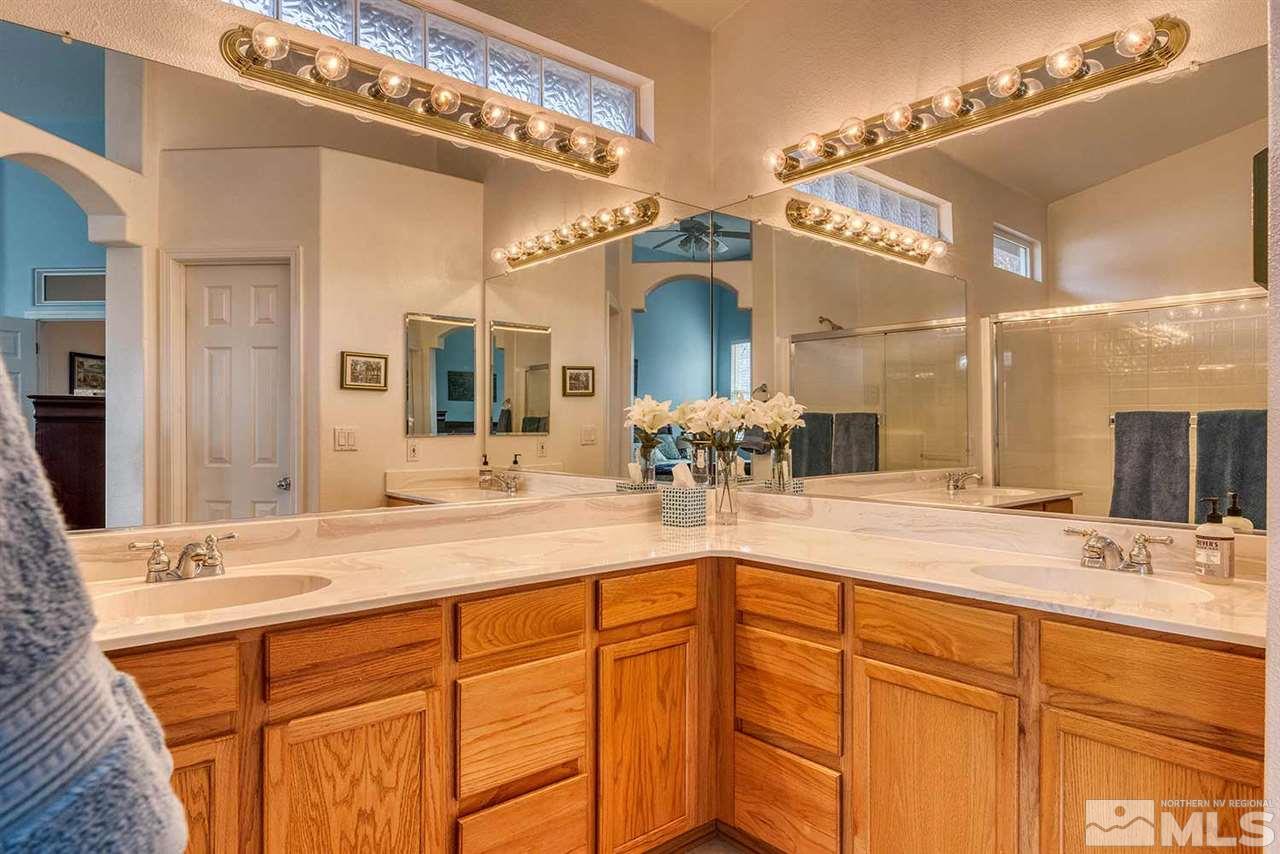 5540 Daybreak Drive Reno, NV 89523 - Photo 17 of 23 a bathroom with a sink and a mirror
