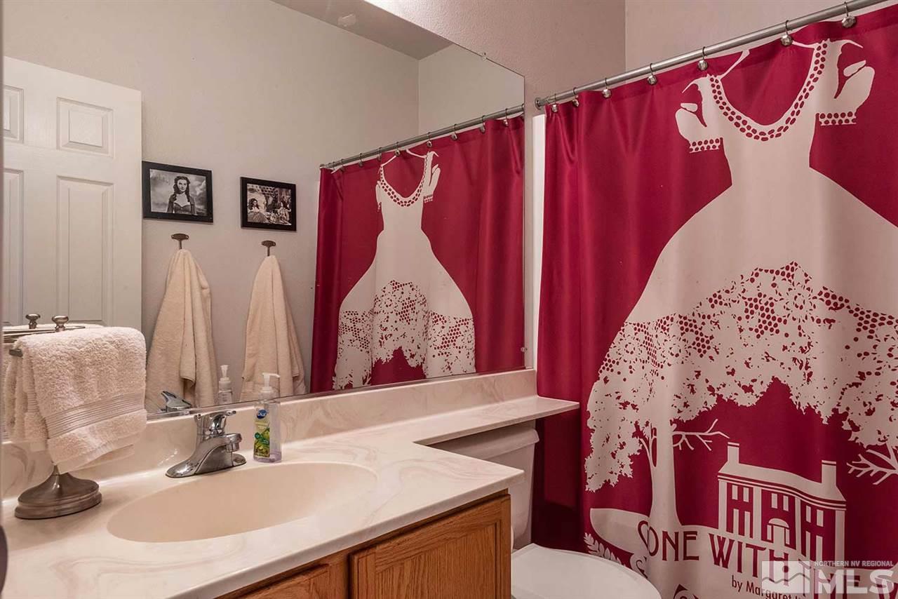 5540 Daybreak Drive Reno, NV 89523 - Photo 19 of 23 a bathroom with a sink and a mirror