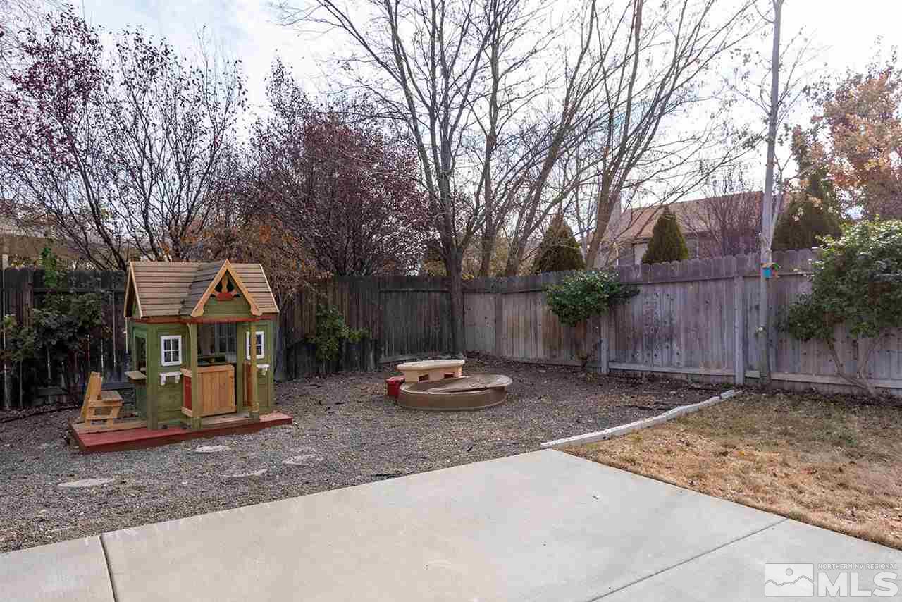 5540 Daybreak Drive Reno, NV 89523 - Photo 23 of 23 a backyard of a house with barbeque oven and outdoor seating