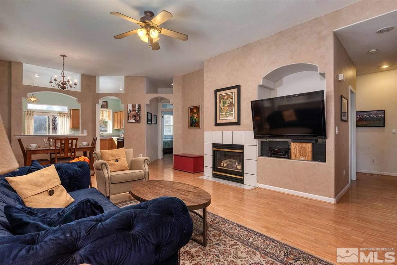 5540 Daybreak Drive Reno, NV 89523 - Photo 3 of 23 a living room with furniture fireplace and flat screen tv