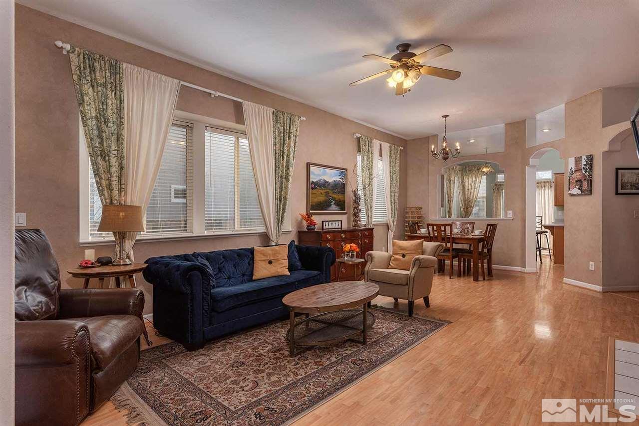 5540 Daybreak Drive Reno, NV 89523 - Photo 4 of 23 a living room with furniture and a chandelier