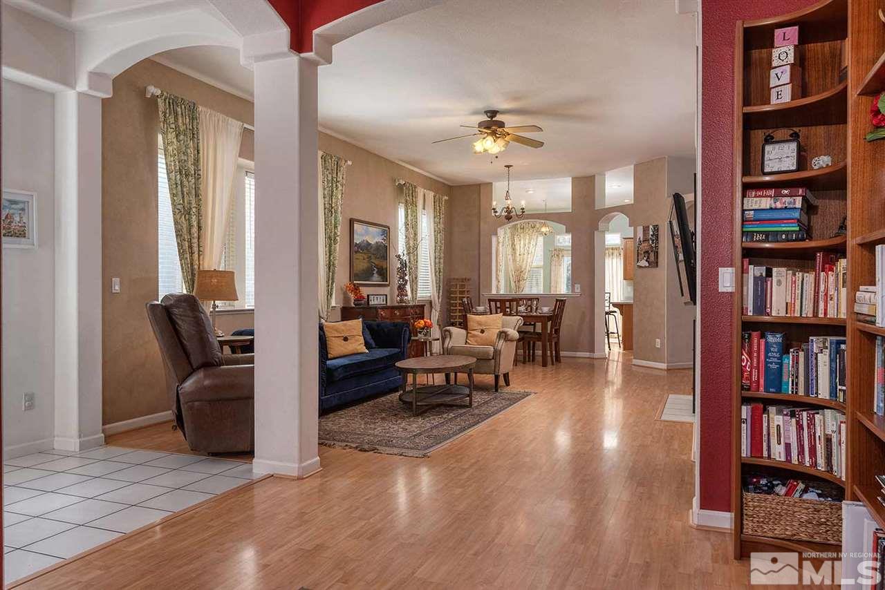 5540 Daybreak Drive Reno, NV 89523 - Photo 5 of 23 a living room with furniture and a book shelf