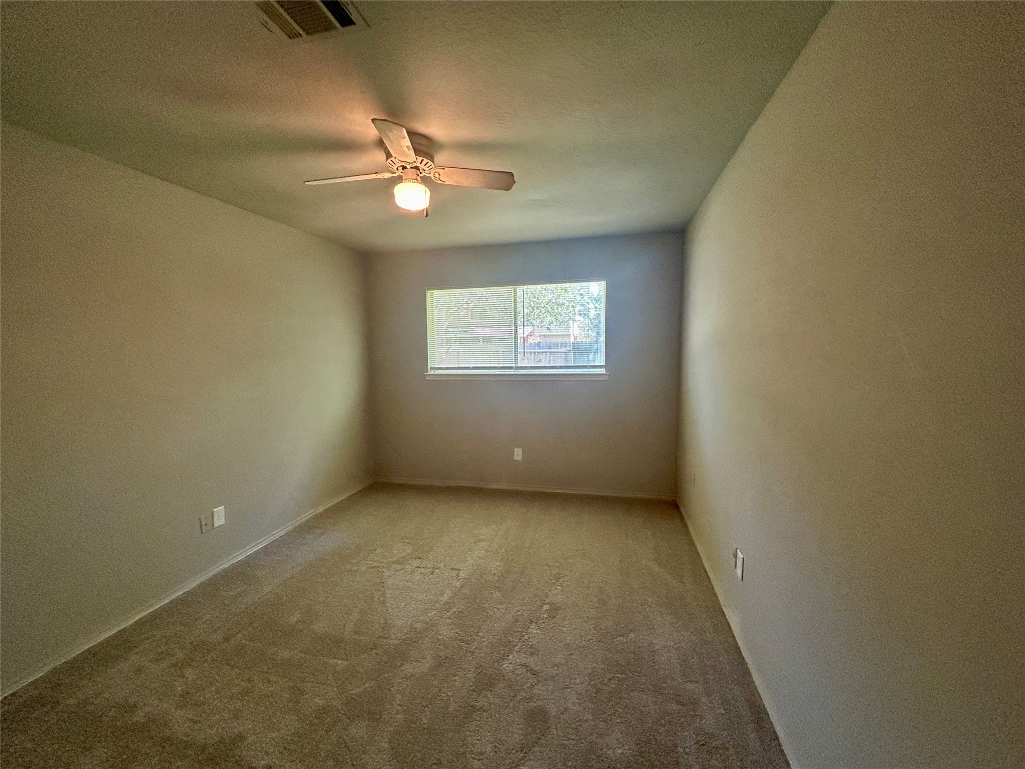2510 Knollbrook Lane Spring, TX 77373 - Photo 14 of 24 an empty room with a window and a fan