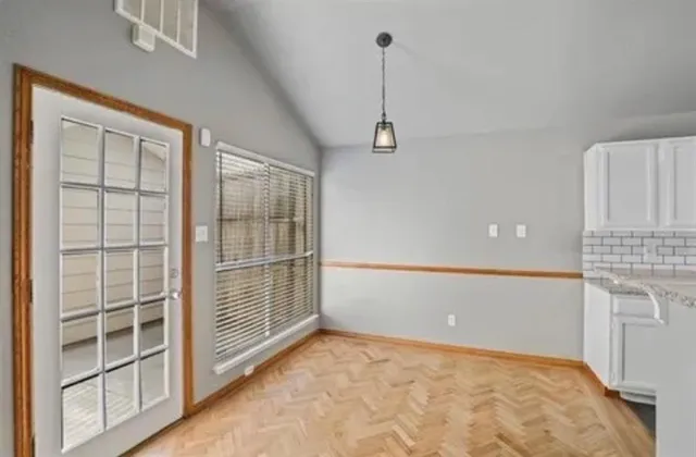 a view of an empty room with a window