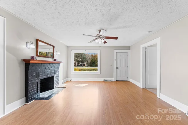 a kitchen with a refrigerator sink and cabinets