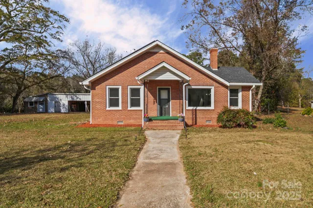 a front view of a house with yard