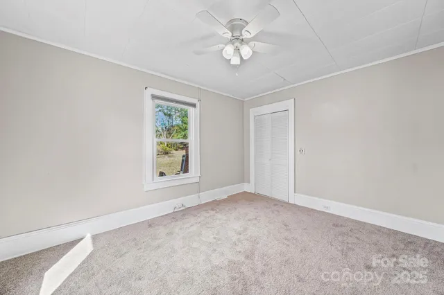 a view of a bathroom with a toilet sink and a mirror