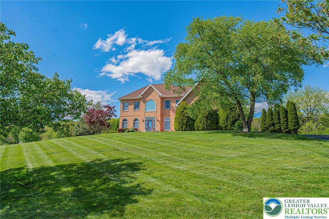 6551 Overlook Road Orefield, PA 18069 - Photo 7 of 82 a front view of a house with garden