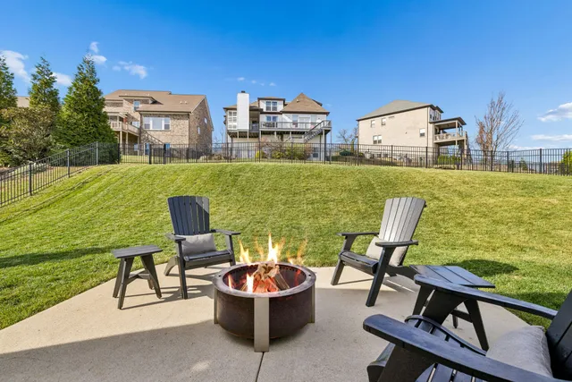 a view of a chairs and table in the balcony