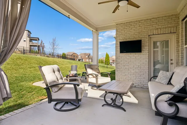 a view of living room with barbeque oven and outdoor seating