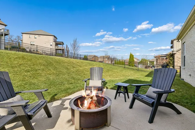 a view of a chairs and table in patio