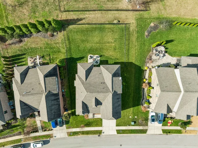 an aerial view of a house with outdoor space