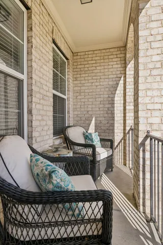 a view of a balcony with chair