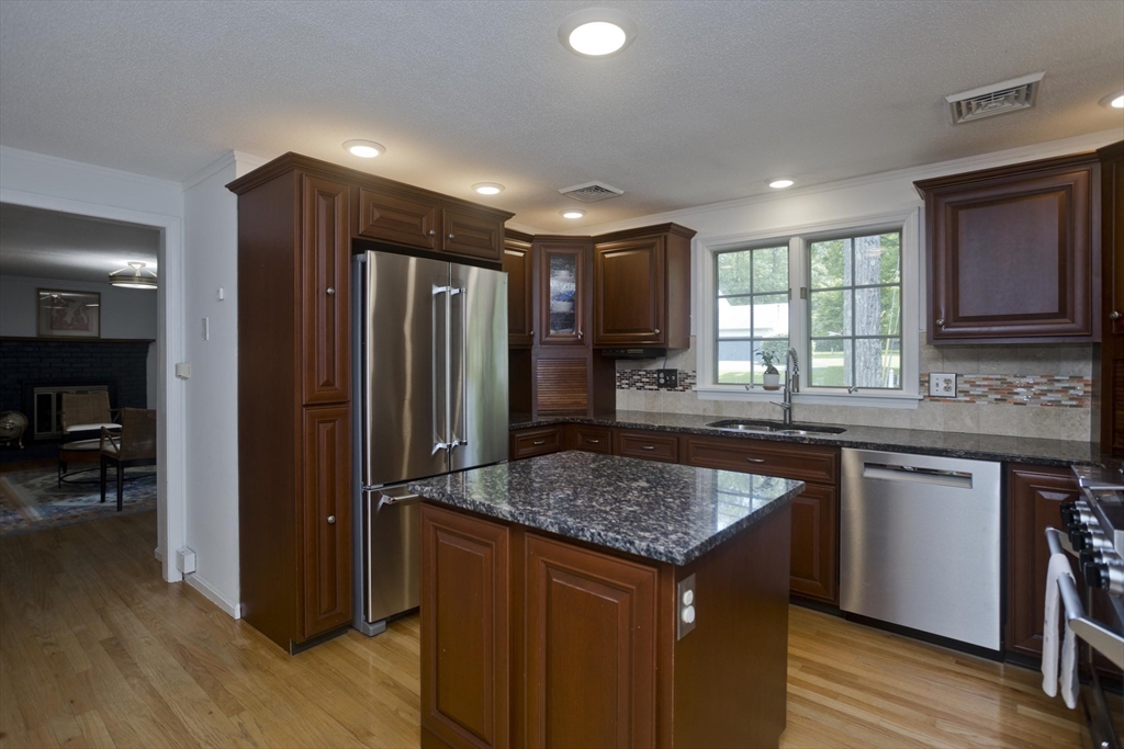 581 Burts Pit Road Northampton, MA 01062 - Photo 11 of 35 a kitchen with stainless steel appliances granite countertop wooden cabinets and a refrigerator