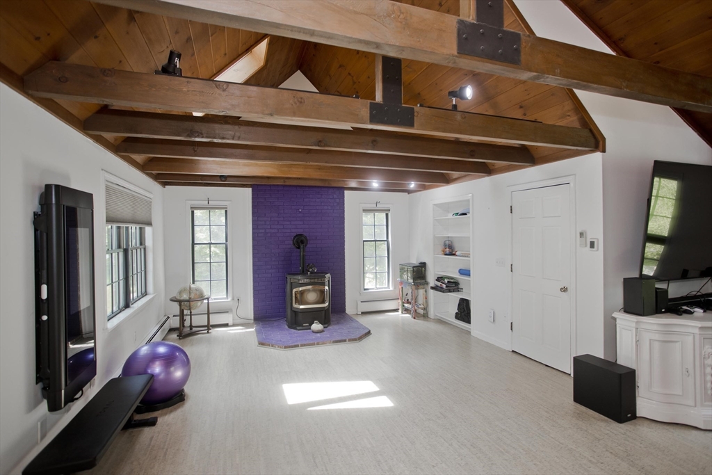 581 Burts Pit Road Northampton, MA 01062 - Photo 13 of 35 a view of living room with furniture and a flat screen tv