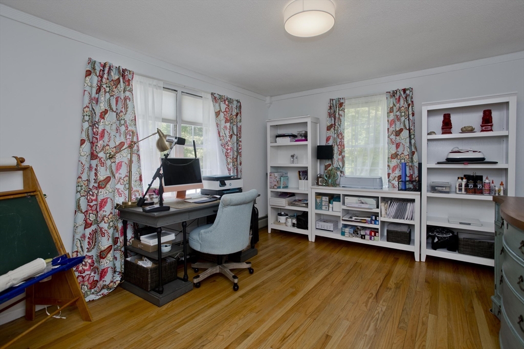 581 Burts Pit Road Northampton, MA 01062 - Photo 18 of 35 a view of a workspace with furniture and wooden floor