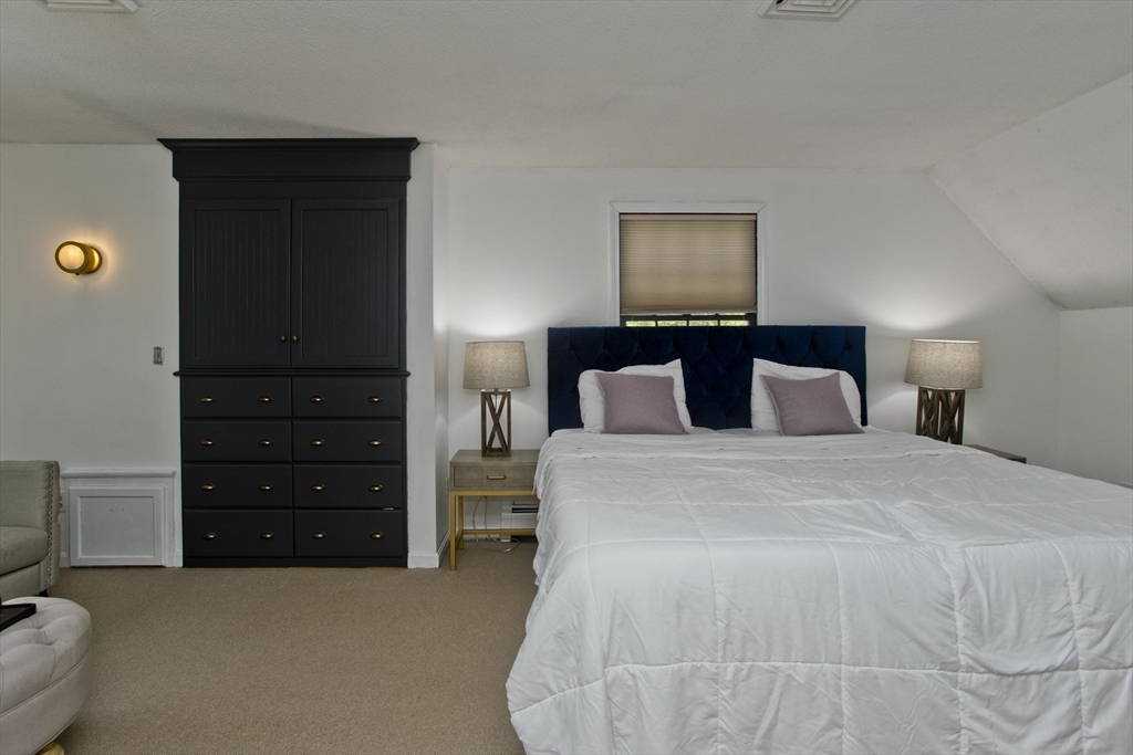 581 Burts Pit Road Northampton, MA 01062 - Photo 20 of 35 a bedroom with a bed and furniture