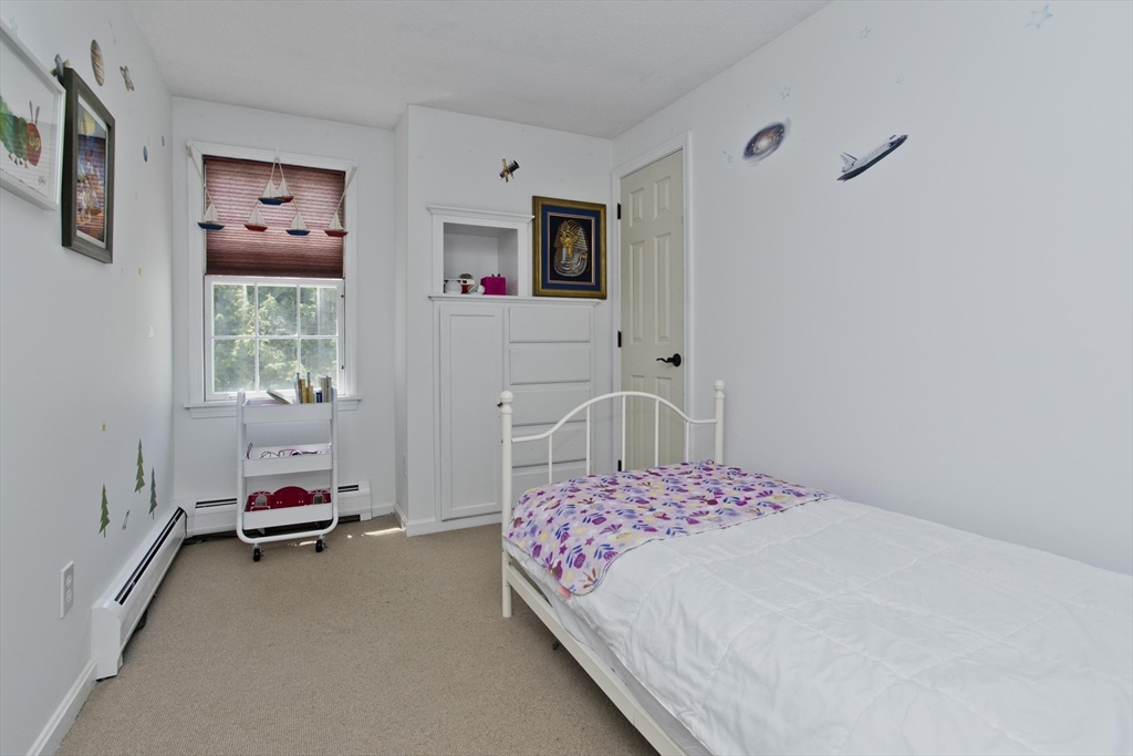 581 Burts Pit Road Northampton, MA 01062 - Photo 23 of 35 a bedroom with a bed and a window