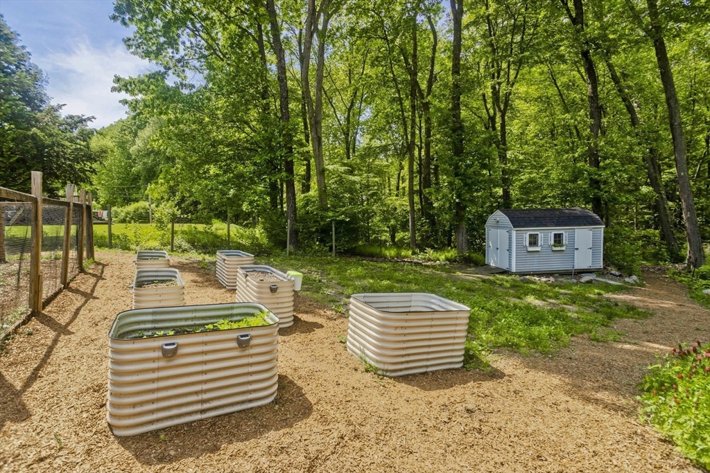581 Burts Pit Road Northampton, MA 01062 - Photo 30 of 35 a view of a patio with a table chairs and a yard