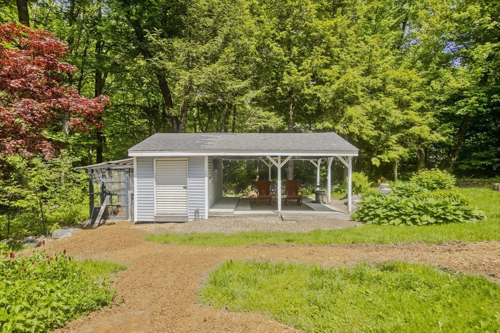 581 Burts Pit Road Northampton, MA 01062 - Photo 31 of 35 a front view of a house with yard and green space