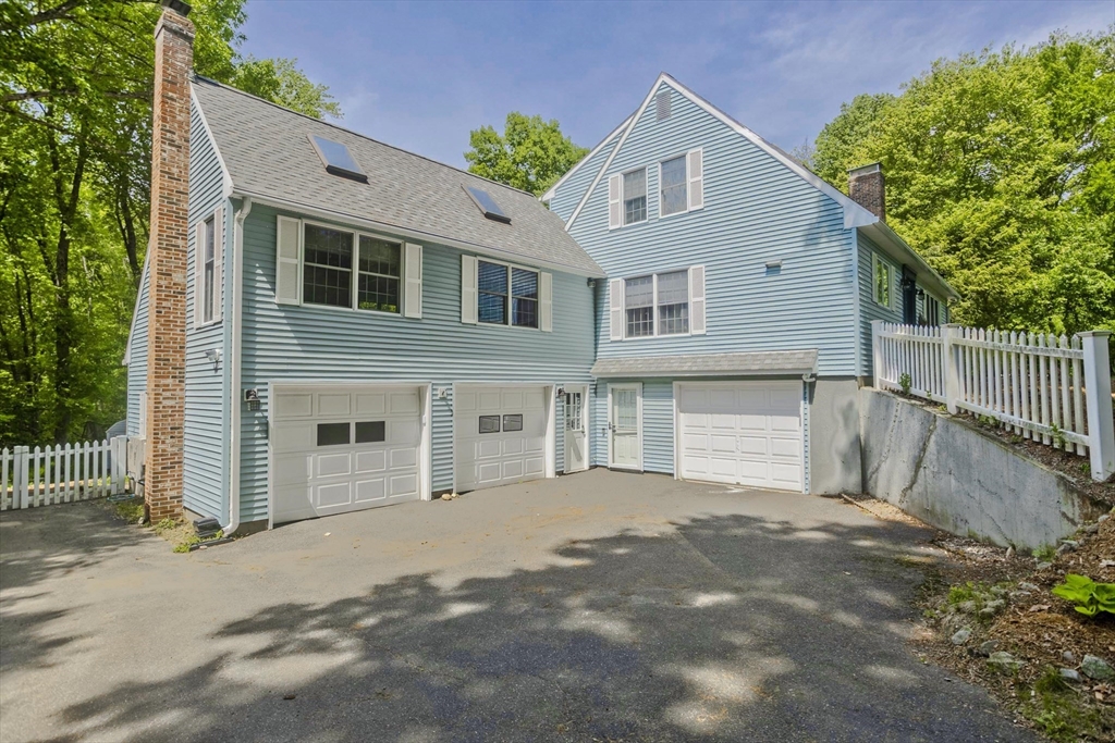 581 Burts Pit Road Northampton, MA 01062 - Photo 4 of 35 a front view of a house with a garage