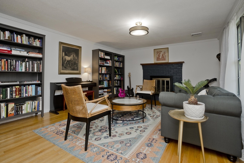 581 Burts Pit Road Northampton, MA 01062 - Photo 5 of 35 a living room with furniture and a book shelf