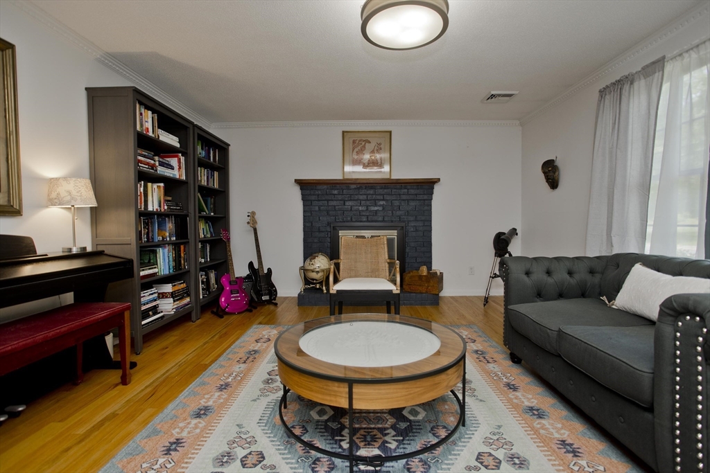 581 Burts Pit Road Northampton, MA 01062 - Photo 6 of 35 a living room with furniture and a fireplace