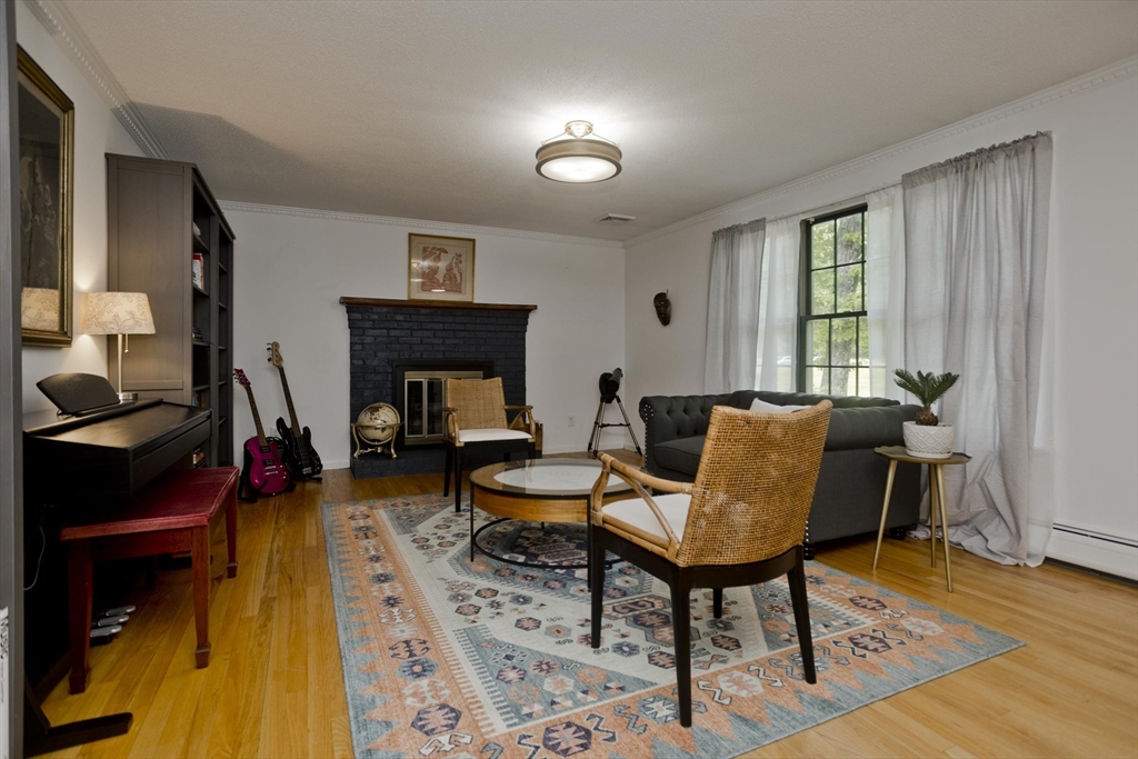 581 Burts Pit Road Northampton, MA 01062 - Photo 7 of 35 a living room with furniture and a fireplace