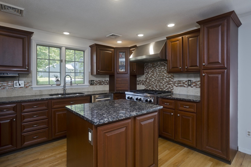 581 Burts Pit Road Northampton, MA 01062 - Photo 9 of 35 a kitchen with kitchen island granite countertop wooden cabinets a sink and dishwasher
