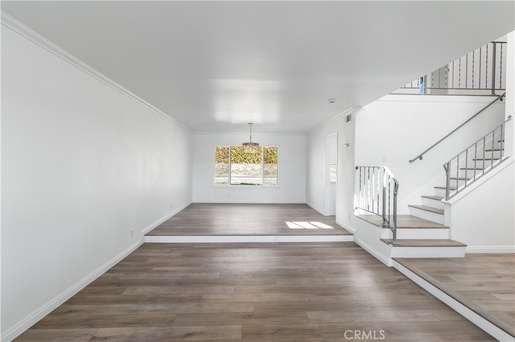 10672 Finch Avenue Rancho Cucamonga, CA 91737 - Photo 12 of 39 a view of entryway and hall with wooden floor