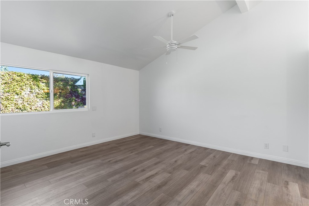 10672 Finch Avenue Rancho Cucamonga, CA 91737 - Photo 24 of 39 an empty room with wooden floor and window