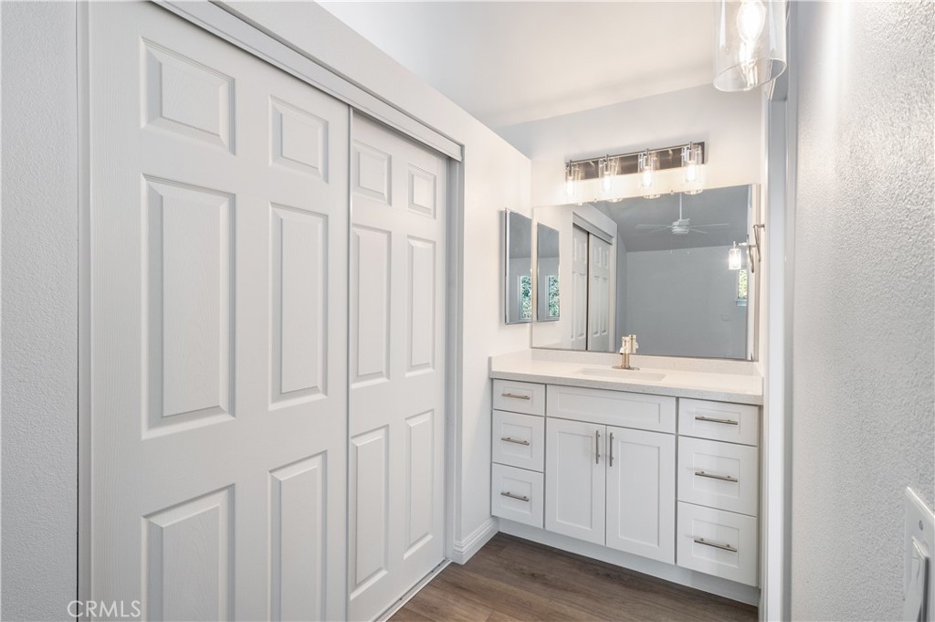 10672 Finch Avenue Rancho Cucamonga, CA 91737 - Photo 25 of 39 a bathroom with a double vanity sink and mirror