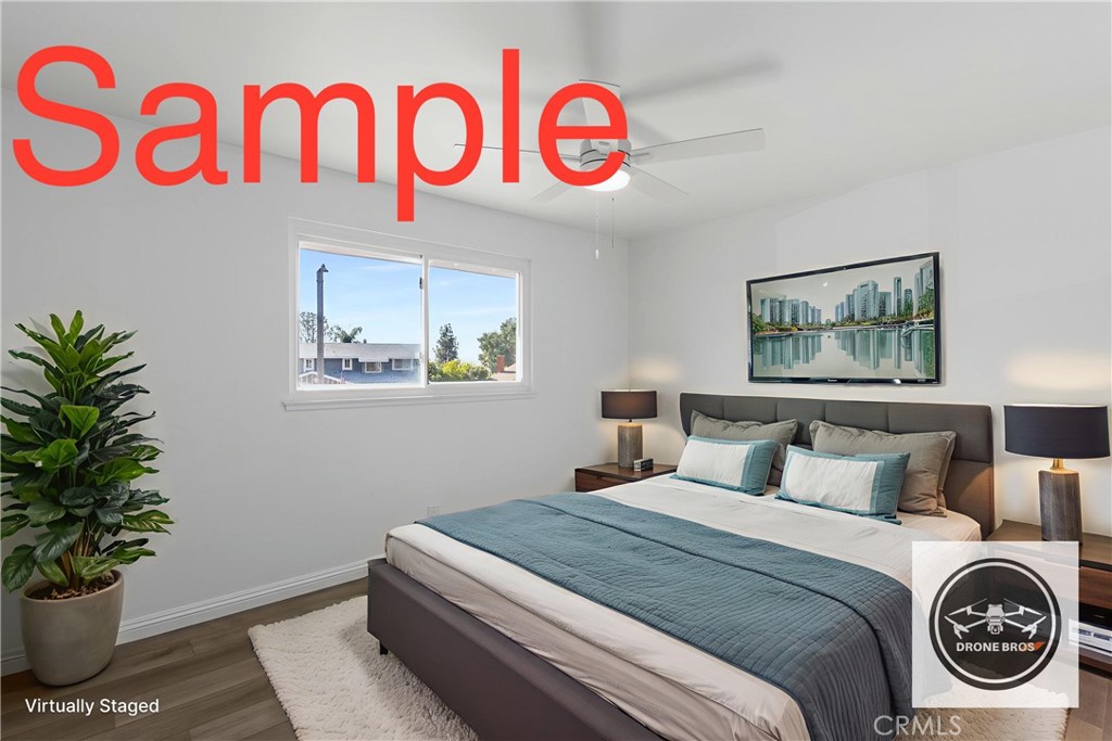 10672 Finch Avenue Rancho Cucamonga, CA 91737 - Photo 27 of 39 a bedroom with a bed and a potted plant