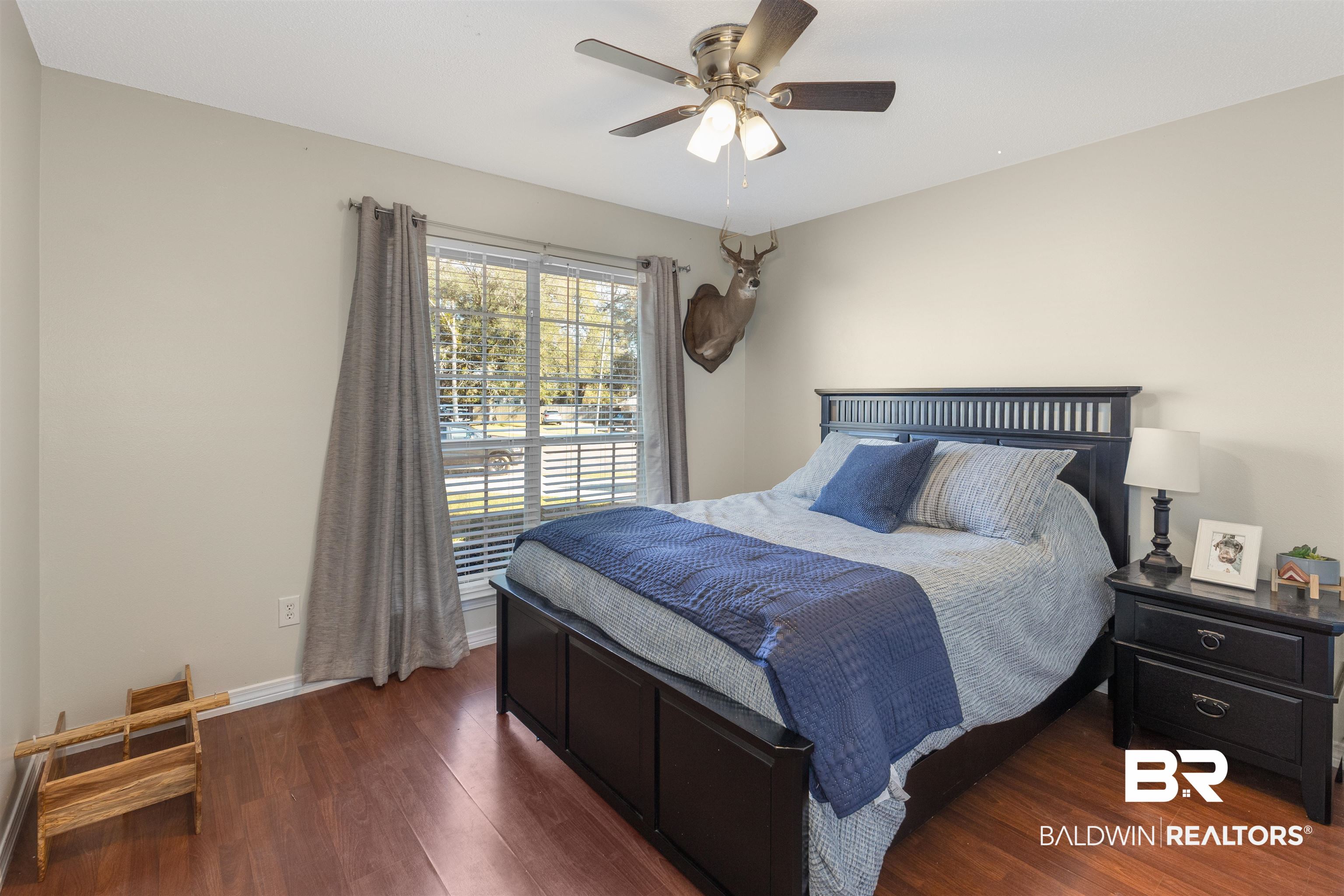 4950 Clealand Court Mobile, AL 36695 - Photo 19 of 20 Bedroom featuring baseboards, a ceiling fan, and wood finished floors