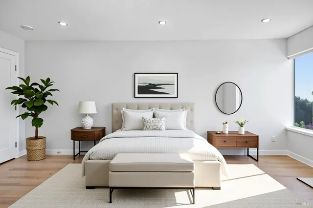 a bed room with a bed and a chair