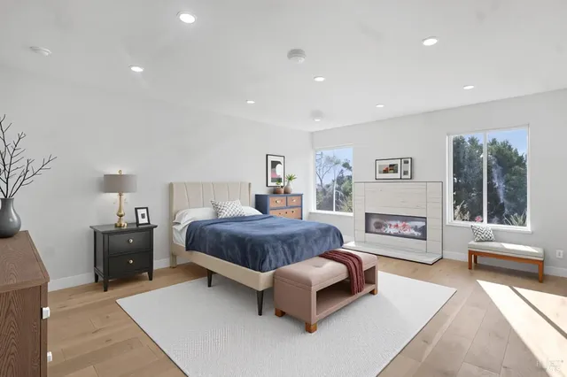 a spacious bedroom with a large bed and a couch